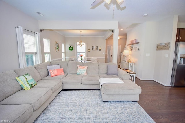 205 Markham St, Suffolk, VA 23435 - living room featuring dark wood finished floors, a ceiling fan, a chandelier, ornamental molding, and baseboards
