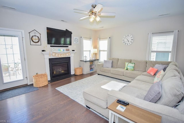 205 Markham St, Suffolk, VA 23435 - living area with a ceiling fan, wood finished floors, a glass covered fireplace, and baseboards