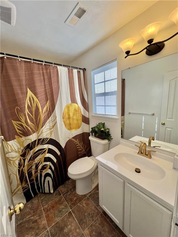 728 S Lake Cir, Chesapeake, VA 23322 - bathroom with toilet, vanity, and curtained shower