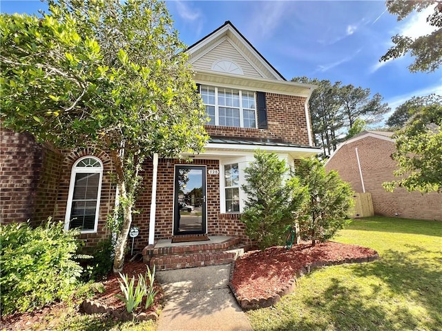 728 S Lake Cir, Chesapeake, VA 23322 - view of front facade with brick siding and a front yard