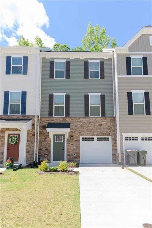 123 Big Woods Dr, Poquoson, VA 23662 - view of property featuring driveway, an attached garage, and stone siding