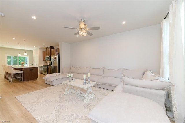 123 Big Woods Dr, Poquoson, VA 23662 - living room featuring light wood-type flooring, ceiling fan, and recessed lighting