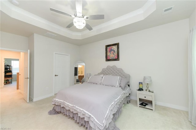 123 Big Woods Dr, Poquoson, VA 23662 - bedroom featuring light carpet, a tray ceiling, baseboards, and ceiling fan