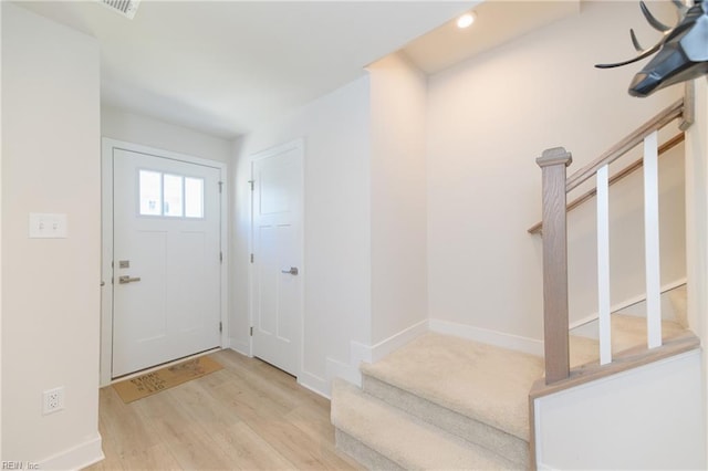 123 Big Woods Dr, Poquoson, VA 23662 - entryway with wood finished floors, stairs, recessed lighting, and baseboards