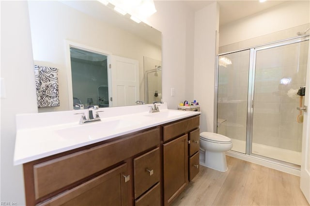 123 Big Woods Dr, Poquoson, VA 23662 - bathroom with toilet, a shower stall, double vanity, and wood finished floors