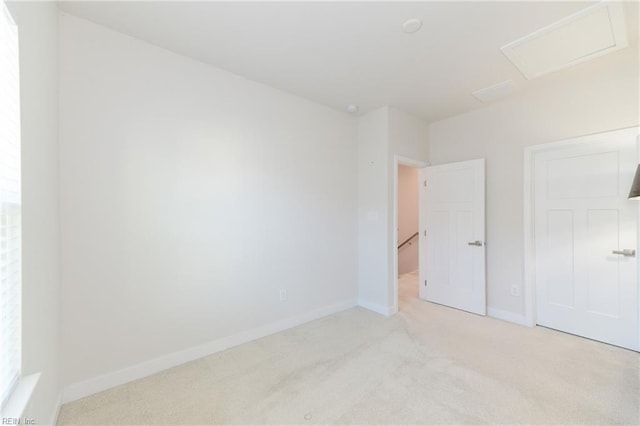 123 Big Woods Dr, Poquoson, VA 23662 - unfurnished bedroom with carpet floors, baseboards, attic access, and a closet