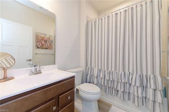 123 Big Woods Dr, Poquoson, VA 23662 - full bathroom featuring vanity, toilet, and shower / tub combo with curtain