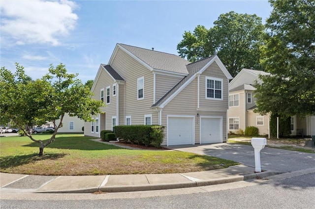408 Holmes Blvd, Yorktown, VA 23692 - view of front of house with a garage, asphalt driveway, and a front yard