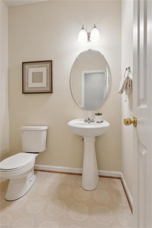 408 Holmes Blvd, Yorktown, VA 23692 - bathroom with baseboards and toilet