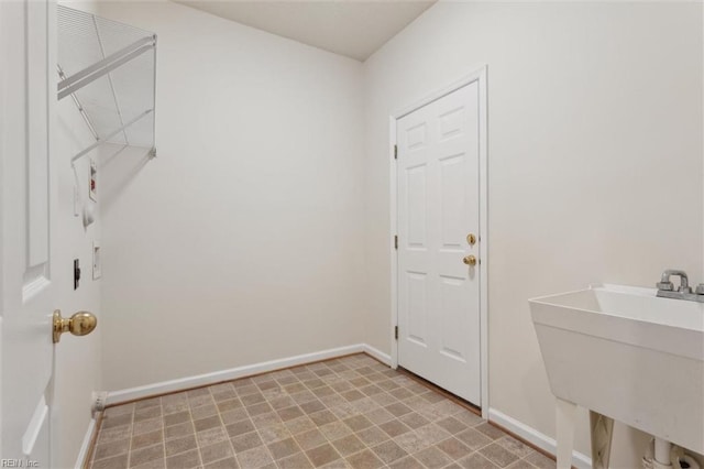 408 Holmes Blvd, Yorktown, VA 23692 - laundry room with baseboards