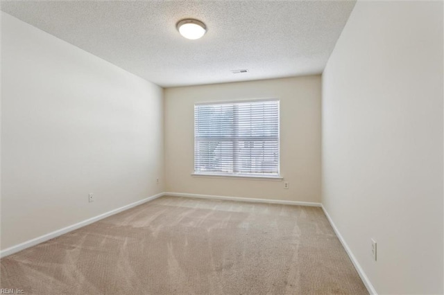 408 Holmes Blvd, Yorktown, VA 23692 - empty room featuring carpet flooring, a textured ceiling, and baseboards
