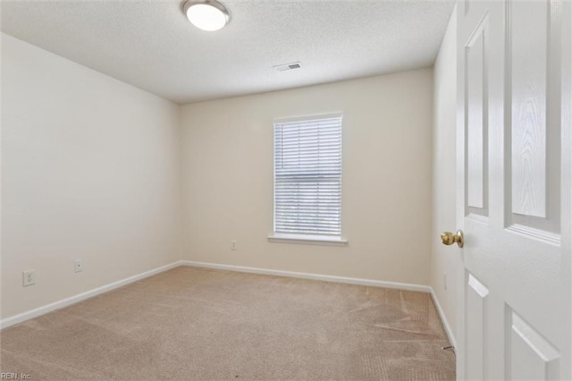 408 Holmes Blvd, Yorktown, VA 23692 - empty room featuring light colored carpet, baseboards, and a textured ceiling