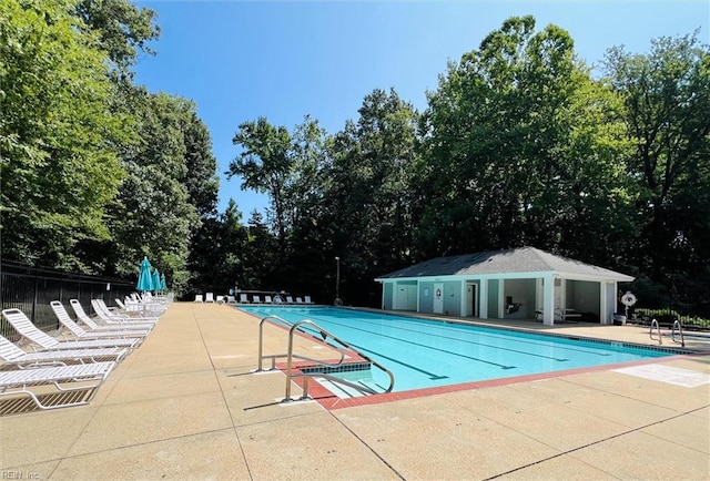 408 Holmes Blvd, Yorktown, VA 23692 - community pool featuring a patio and view of scattered trees