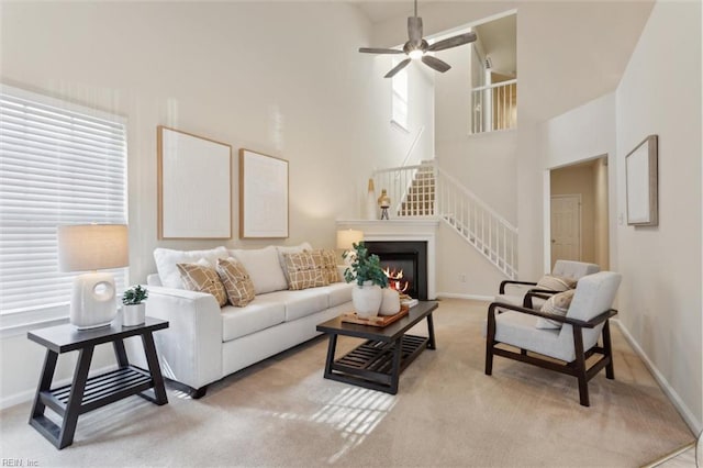 408 Holmes Blvd, Yorktown, VA 23692 - living area with a towering ceiling, baseboards, stairs, ceiling fan, and healthy amount of natural light