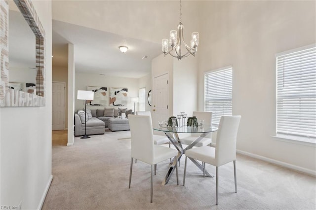 408 Holmes Blvd, Yorktown, VA 23692 - dining space with light carpet, a chandelier, and baseboards