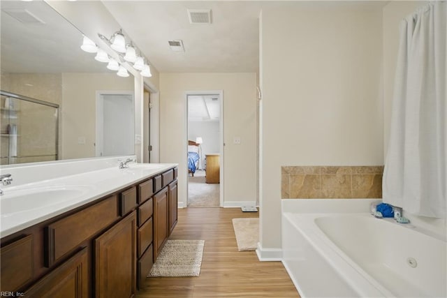 1200 Althea Ct, Chesapeake, VA 23322 - full bathroom with a whirlpool tub, wood finished floors, double vanity, a shower stall, and baseboards