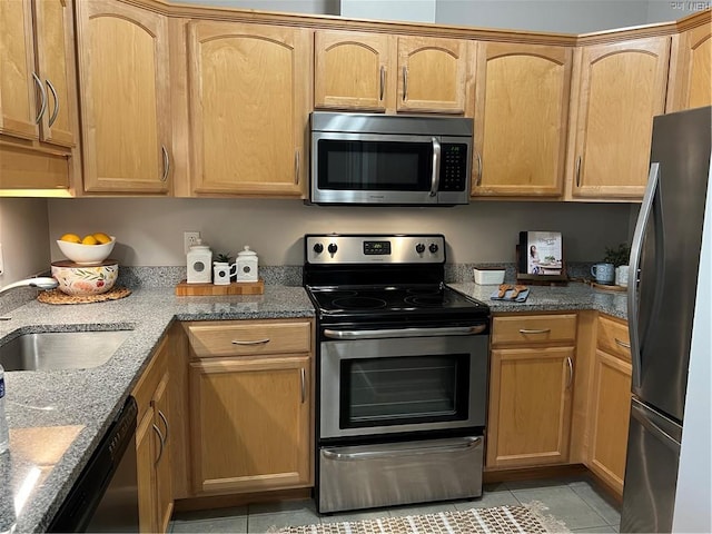 249 W Freemason St Unit 405, Norfolk, VA 23510 - kitchen with stainless steel appliances, light tile patterned flooring, a sink, and stone countertops
