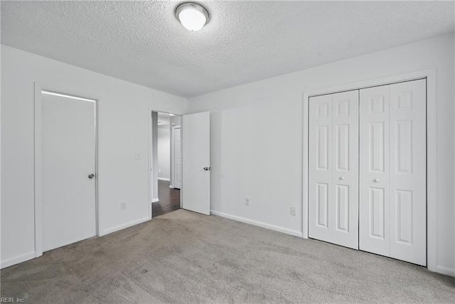 5101 Glenwood Way, Virginia Beach, VA 23456 - unfurnished bedroom featuring carpet, a textured ceiling, baseboards, and a closet