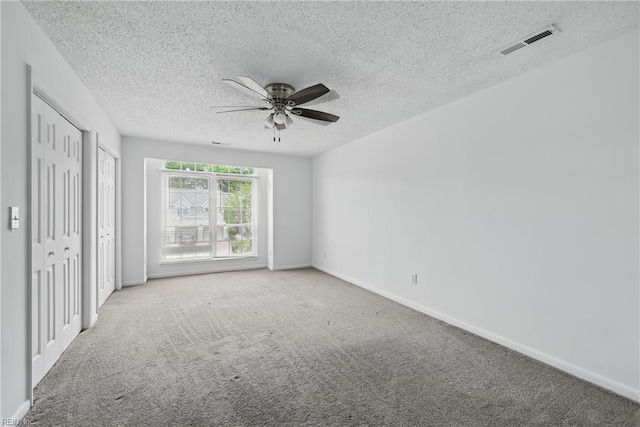 5101 Glenwood Way, Virginia Beach, VA 23456 - unfurnished bedroom featuring carpet, a textured ceiling, multiple closets, and baseboards