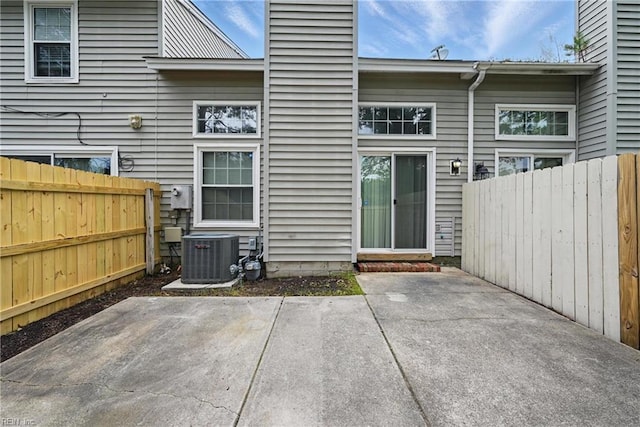5101 Glenwood Way, Virginia Beach, VA 23456 - rear view of house with central AC, a patio, and a chimney