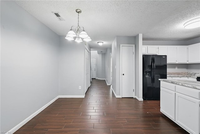 5101 Glenwood Way, Virginia Beach, VA 23456 - kitchen with black refrigerator with ice dispenser, baseboards, a textured ceiling, dark wood-type flooring, and white cabinetry