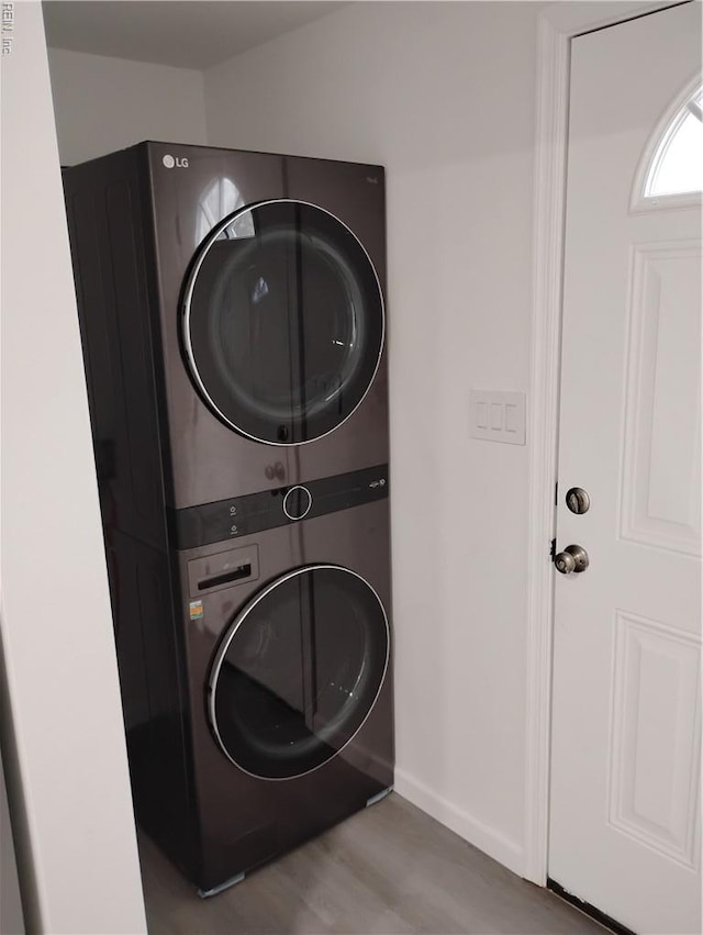 624 Crystal Ave, Chesapeake, VA 23324 - washroom featuring stacked washing machine and dryer, wood finished floors, and baseboards