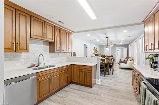3607 Lafayette Blvd, Norfolk, VA 23513 - kitchen with stainless steel appliances, a sink, brown cabinetry, and recessed lighting