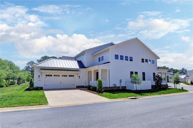 103 Enclave Ct, Williamsburg, VA 23185 - view of front of home with driveway, a garage, a front yard, a standing seam roof, and covered porch