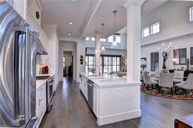 103 Enclave Ct, Williamsburg, VA 23185 - kitchen with appliances with stainless steel finishes, a sink, light countertops, decorative columns, and white cabinetry