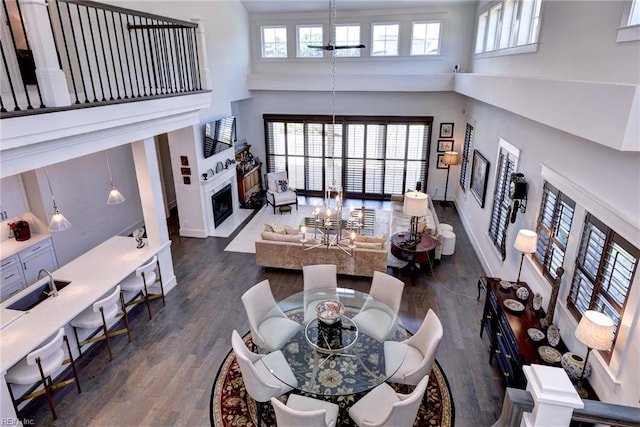 103 Enclave Ct, Williamsburg, VA 23185 - living area featuring a high ceiling, a fireplace with flush hearth, wood finished floors, and baseboards
