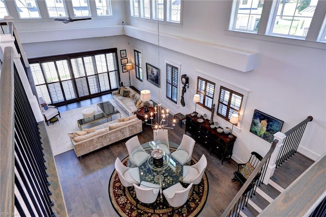 103 Enclave Ct, Williamsburg, VA 23185 - living room with a towering ceiling, wood finished floors, and baseboards