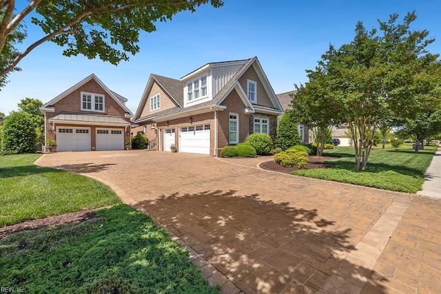 312 Cawdor Xing, Chesapeake, VA 23322 - view of front of property featuring brick siding, a garage, decorative driveway, and a front yard