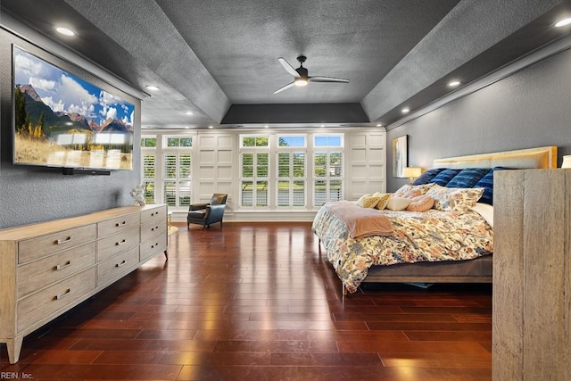 312 Cawdor Xing, Chesapeake, VA 23322 - bedroom with wood finished floors, a textured wall, a tray ceiling, a textured ceiling, and recessed lighting