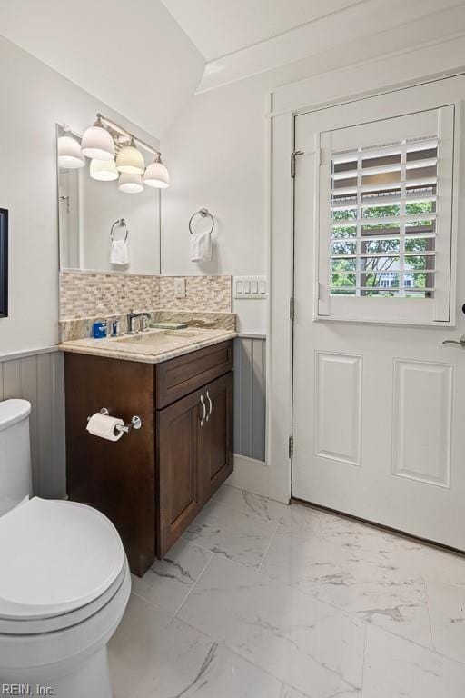 312 Cawdor Xing, Chesapeake, VA 23322 - bathroom with toilet, vanity, marble look tiles, and wainscoting