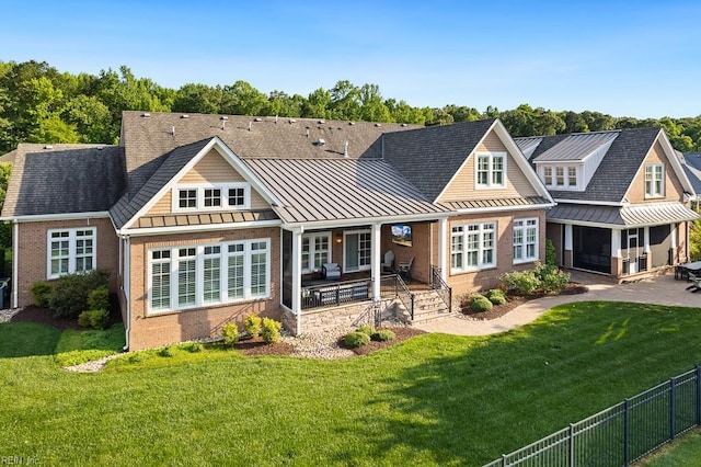 312 Cawdor Xing, Chesapeake, VA 23322 - rear view of house featuring a standing seam roof, brick siding, and metal roof