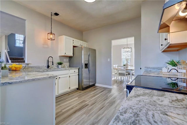 100 Langston Ct, Franklin, VA 23851 - kitchen featuring stainless steel fridge, a sink, light wood-type flooring, and plenty of natural light