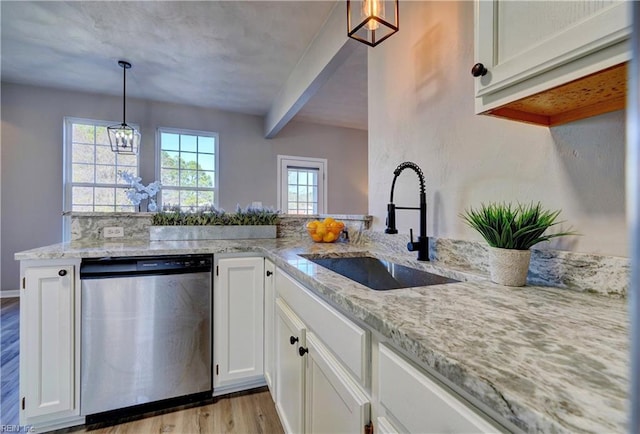 100 Langston Ct, Franklin, VA 23851 - kitchen featuring dishwasher, a sink, light wood-style flooring, light stone counters, and a peninsula