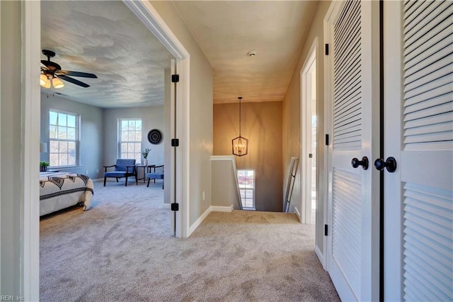 100 Langston Ct, Franklin, VA 23851 - hallway with an upstairs landing, carpet, and baseboards