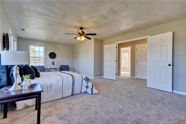 100 Langston Ct, Franklin, VA 23851 - bedroom featuring baseboards, light carpet, and ceiling fan