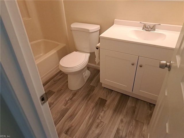 5528 Baccalaureate Dr, Virginia Beach, VA 23462 - bathroom featuring toilet, wood finished floors, vanity, shower / tub combination, and baseboards