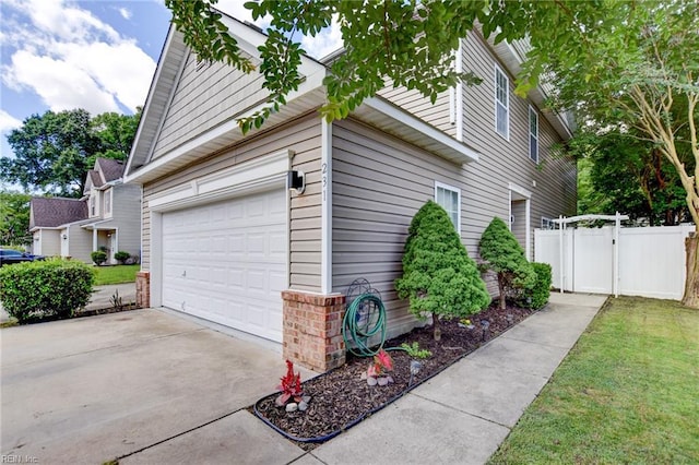 231 Sykes Ave Unit 231, Virginia Beach, VA 23454 - view of home's exterior featuring a garage and driveway