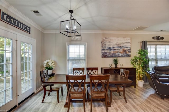 231 Sykes Ave Unit 231, Virginia Beach, VA 23454 - dining area featuring light wood-style flooring, a chandelier, ornamental molding, and baseboards