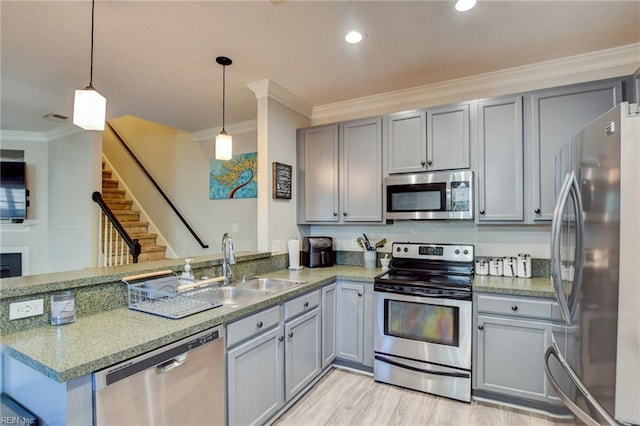 231 Sykes Ave Unit 231, Virginia Beach, VA 23454 - kitchen featuring stainless steel appliances, gray cabinets, a peninsula, crown molding, and hanging light fixtures