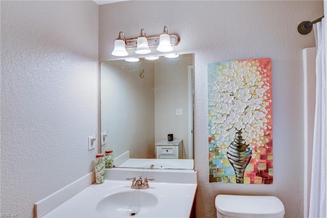 231 Sykes Ave Unit 231, Virginia Beach, VA 23454 - bathroom featuring toilet, vanity, and a textured wall