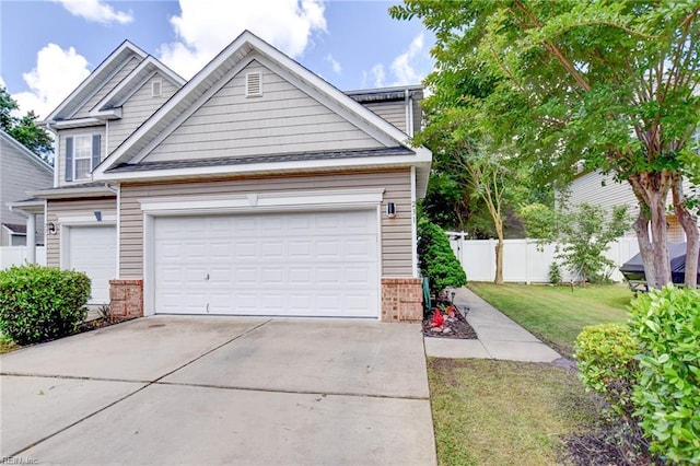 231 Sykes Ave Unit 231, Virginia Beach, VA 23454 - view of front of home featuring brick siding, concrete driveway, and an attached garage
