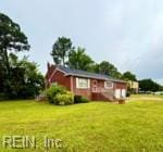 124 Southerland Dr, Hampton, VA 23669 - view of front facade with a front lawn