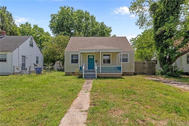 3505 Commonwealth Ave, Portsmouth, VA 23707 - bungalow-style house featuring covered porch and a gate
