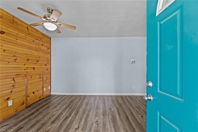 3505 Commonwealth Ave, Portsmouth, VA 23707 - unfurnished room featuring wood finished floors, baseboards, ceiling fan, and wood walls