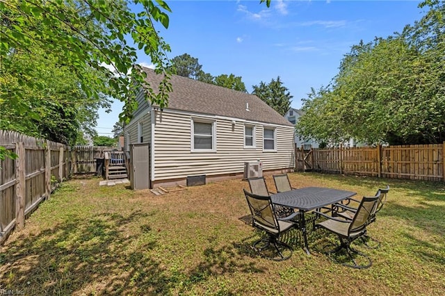 3505 Commonwealth Ave, Portsmouth, VA 23707 - rear view of property featuring roof with shingles and central AC