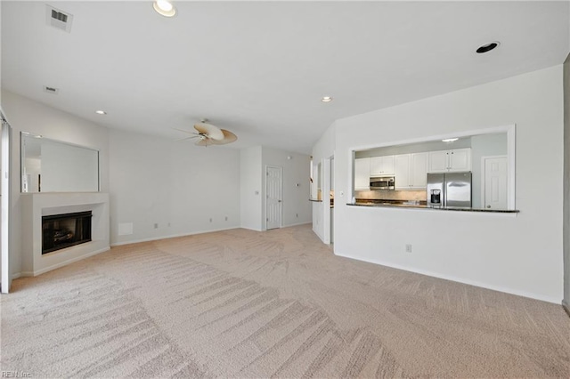 9489 Mooring Dr, Norfolk, VA 23518 - unfurnished living room featuring light carpet, ceiling fan, a fireplace, recessed lighting, and baseboards